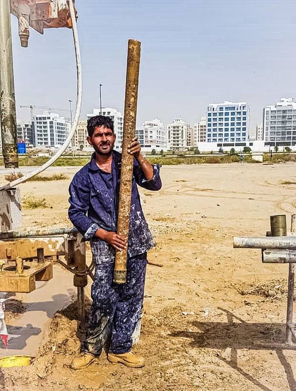 Technician holding a recovered core sample on site