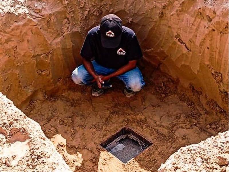 Soil infiltration test performed in a trial pit
