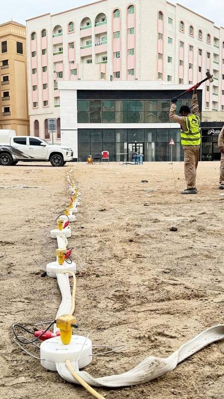 MASW test source point with sledgehammer and geophone line