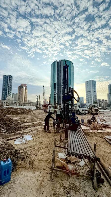 Rotary borehole drilling rig against the Sharjah skyline