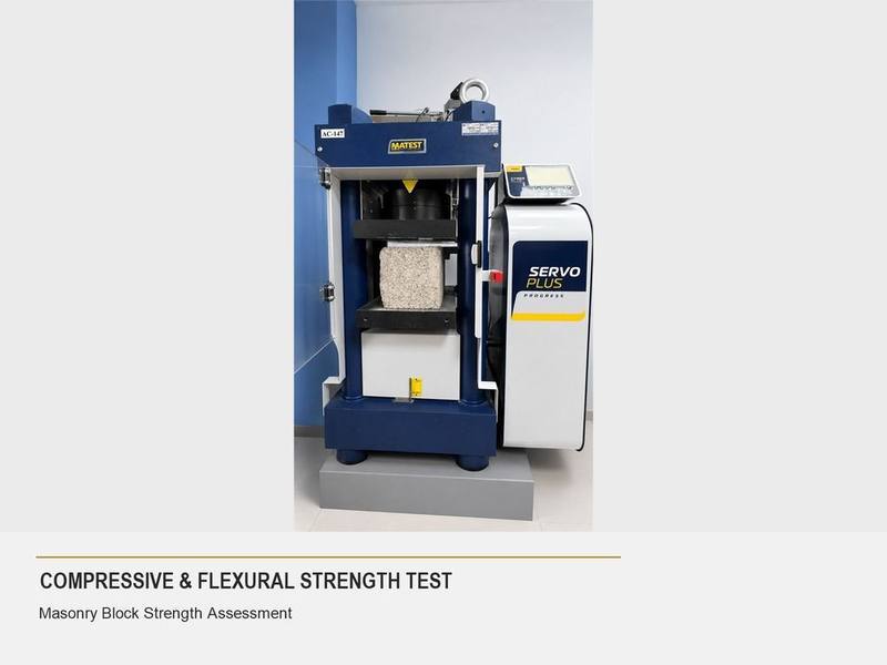 Compressive and flexural strength testing machine with a masonry block specimen