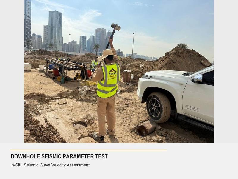 Abaad technician performing a downhole seismic parameter test with the Sharjah skyline in view