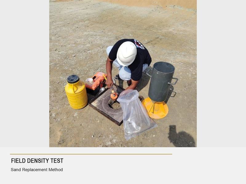 Abaad technician performing a field density test using the sand replacement method