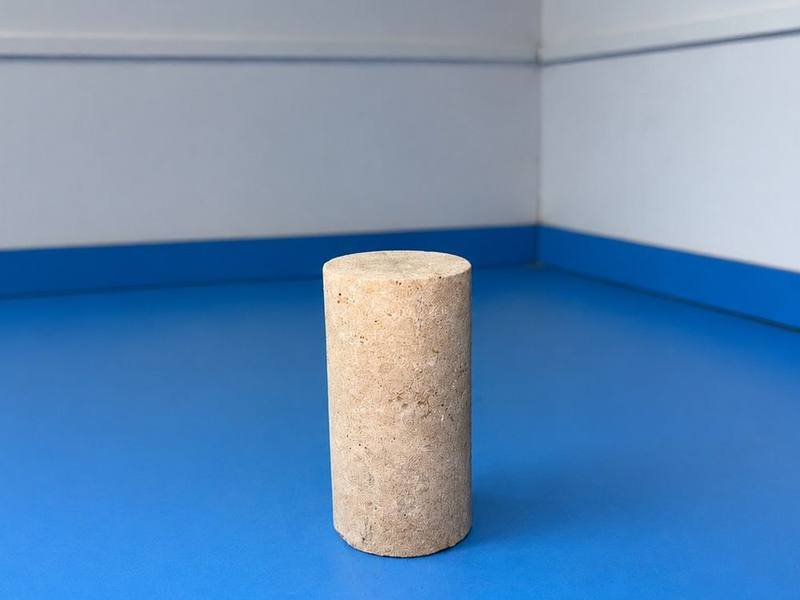 Cylindrical rock core sample prepared for unconfined compressive strength testing