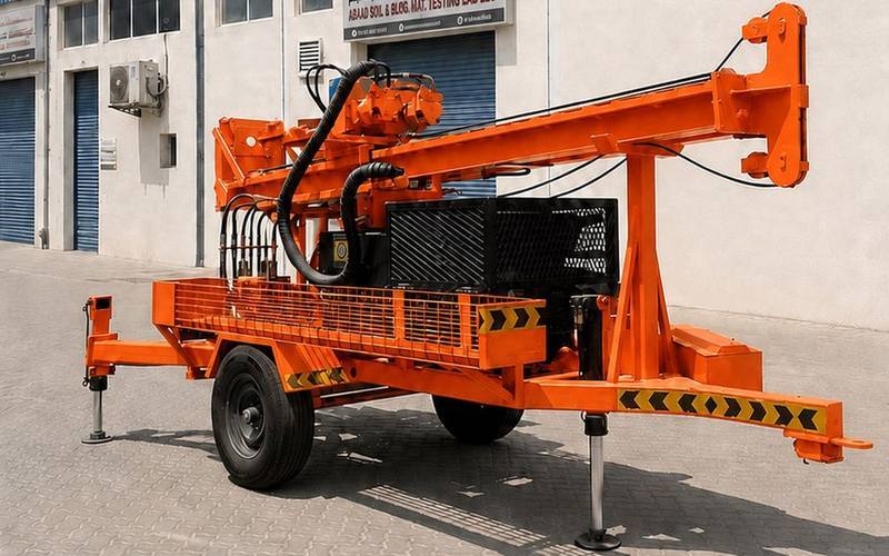 Abaad SWAKDRILL rotary drilling rig, orange chassis, at the Abaad Sharjah yard
